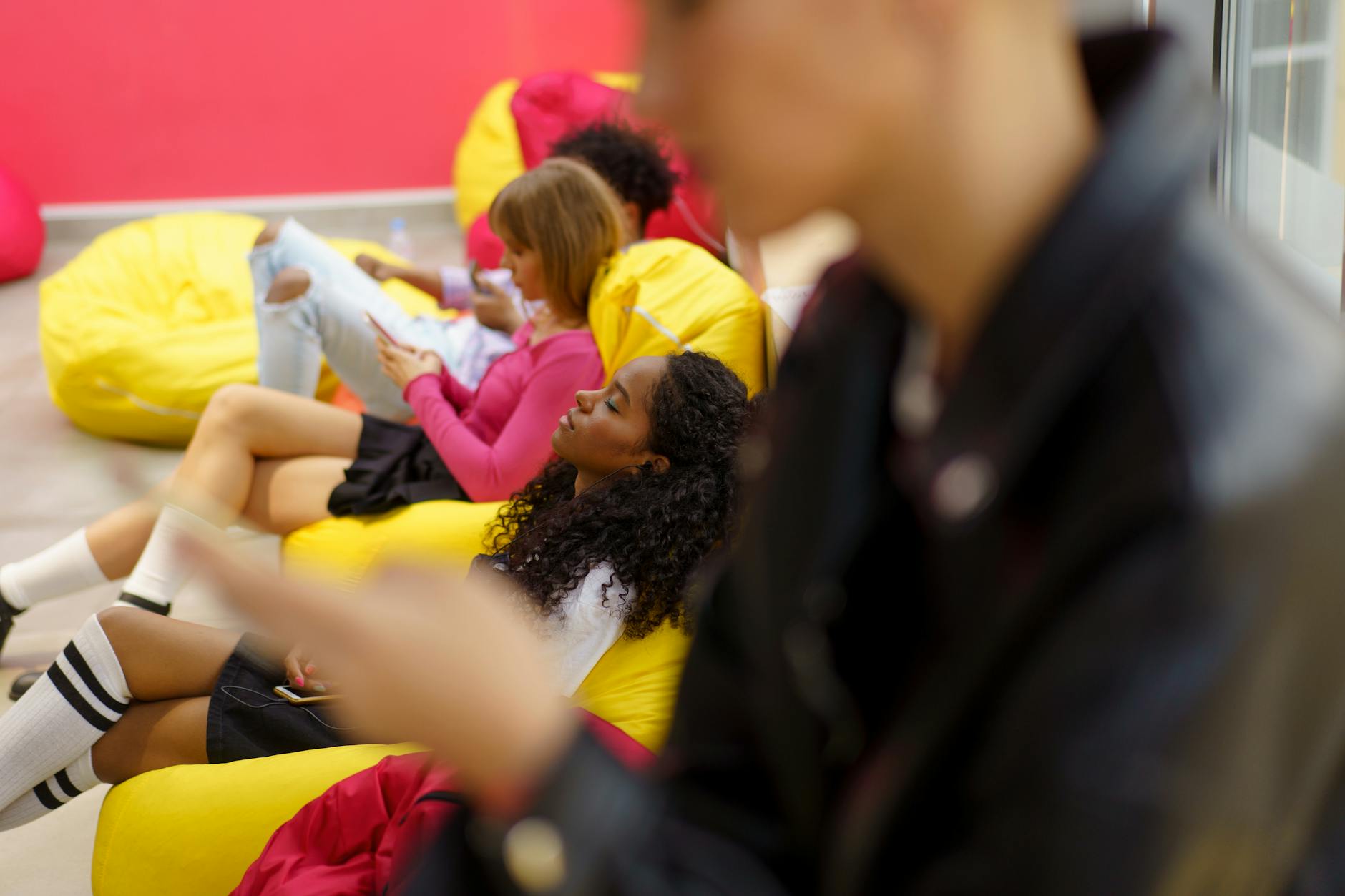 a girl taking a rest on a bean bag chair